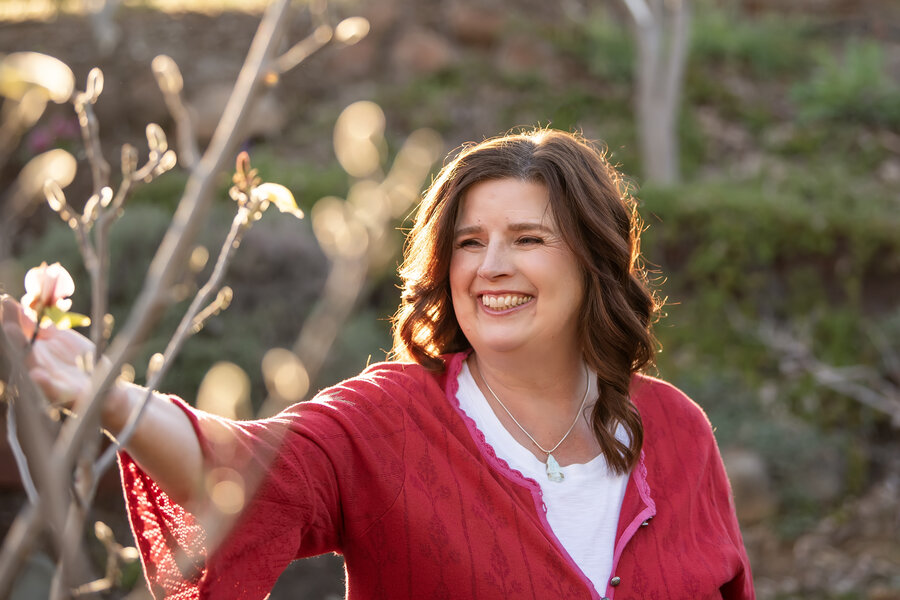 Dr. Maria Katharina Inglesby smiling in a garden at golden hour